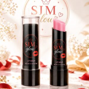 SIM Glow moisturizing lip balm in sleek black packaging with a soft pink balm stick, displayed on a marble surface with rose petals and a luxurious floral background. Perfect for nourishing, hydrating, and enhancing natural lips.