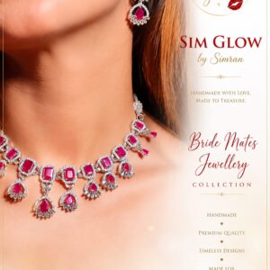 MODEL WEARING SIM GLOW RUBY RED BRIDAL NECKLACE AND MATCHING EARRINGS FROM THE BRIDE MATES JEWELLERY COLLECTION.