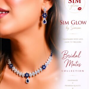A close-up of a model wearing an elegant blue gemstone bridal necklace and matching earrings. The image features SIM Glow by Simran branding and promotes the handmade Bridal Mates Collection for weddings.
