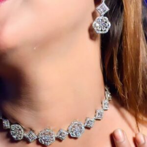 MODEL WEARING SIM GLOW SILVER AMERICAN DIAMOND NECKLACE AND MATCHING EARRINGS FROM THE BRIDAL MATES COLLECTION.