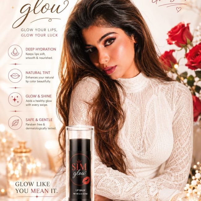 SIM Glow moisturizing lip balm in sleek black packaging with a soft pink balm stick, displayed on a marble surface with rose petals and a luxurious floral background. Perfect for nourishing, hydrating, and enhancing natural lips.